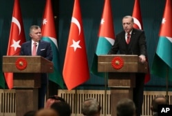 Turkey's President Recep Tayyip Erdogan, right, talks during a joint news conference with Jordan's King Abdullah II, left, at the Presidential Palace in Ankara, Turkey, Dec. 6, 2017. Erdogan has warned that the recognition of Jerusalem as Israel's capital will lead to "public unrest" in the Islamic world.