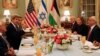 Secretary of State John Kerry, second left, is seated with Israel's Justice Minister and chief negotiator Tzipi Livni, second right, Palestinian chief negotiator Saeb Erekat, right, and Yitzhak Molcho, an adviser to Israeli Prime Minister Benjamin Netanya