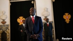 FILE - Guinea-Bissau's President Jose Mario Vaz speaks with journalists after a meeting with his Portuguese counterpart Anibal Cavaco Silva (not pictured) at Belem presidential palace in Lisbon, June 19, 2014. 
