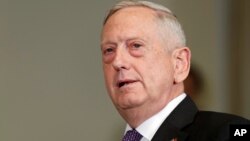 FILE - Defense Secretary Jim Mattis speaks at the Pentagon, Aug. 15, 2017. 