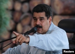 Venezuela's President Nicolas Maduro speaks during a visit to an industrial sawmill in Chaguaramas, Venezuela, Aug. 18, 2016. (Miraflores Palace/Handout)