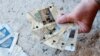 Archeological playing cards, created by US Army archeologist Dr. Laurie Rush and her colleagues, help troops recognize and respect the cultural heritage in the countries where they’re deployed. (Photo by Luigi Fraboni)