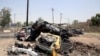 خودروهای آسیب دیده پس از انفجار یک دستگاه خودرو بمبگذاری شده در ورودی شهرک خلیص در شمال بغداد - ۴ مرداد ۱۳۹۵ 