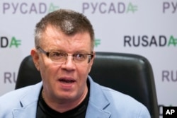 FILE - Nikita Kamaev, managing director of Russian anti-doping agency (RUSADA), talks to reporters at the agency headquarters in Moscow, Nov. 10, 2015.
