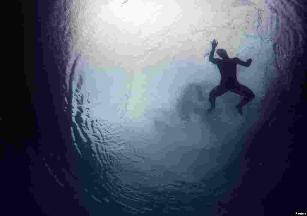 A diver from the U.S is seen underwater during a practice session at the Olympic diving venue in Rio de Janeiro, Brazil.