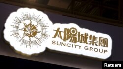 FILE - A logo of Macau junket operator Suncity Group is seen at a gaming fair in Macau, China Nov.18, 2015. 