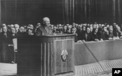 FILE - Soviet leader Nikita Khrushchev addresses a huge rally in the Lenin sports stadium in Moscow, April 10, 1958.
