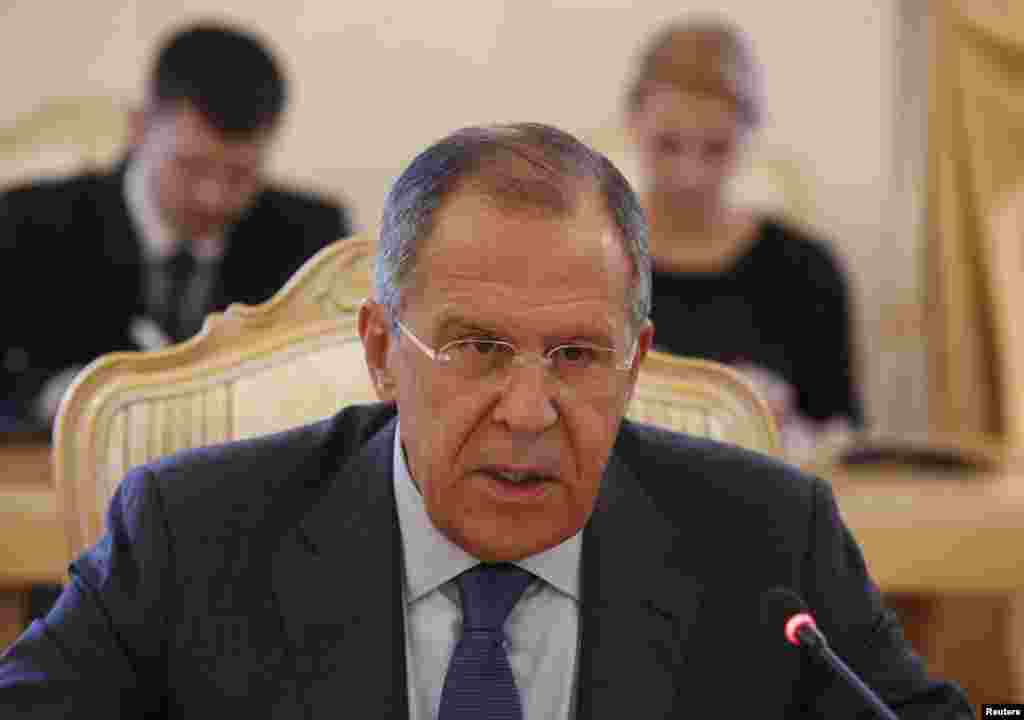 Russia's Foreign Minister Sergei Lavrov addresses his Tunisian counterpart Mongi Hamdi (not pictured) during their meeting in Moscow, Sept. 2, 2014.