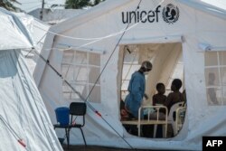 Patients are accommodated in a treatment tent at Macurungo urban health center in Beira, Mozambique, March 27, 2019.