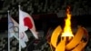 The Olympic flame burns during the opening Api Olimpiade menyala saat upacara pembukaan di Stadion Olimpiade pada Olimpiade Musim Panas 2020, Jumat, 23 Juli 2021, di Tokyo, Jepang. (Foto: AP/Petr David Josek)