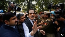 FILE - head of Sahara India conglomerate Subrata Roy speaks to the media as he arrives at the Supreme Court for a hearing in New Delhi, India, Mar. 4, 2014.