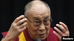 Tibetan spiritual leader the Dalai Lama speaks before members of the Japanese parliament, at the upper house members' office building in Tokyo, November 13, 2012.