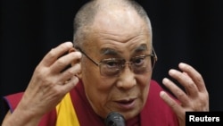 Tibetan spiritual leader the Dalai Lama speaks before members of the Japanese parliament, at the upper house members' office building in Tokyo, November 13, 2012.