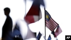 A Malaysian flag among other flags at the Trans-Pacific Partnership Free Trade Agreement talks, San Diego, July 10, 2012.