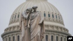 The U.S. Capitol Dome is seen behind the Peace Monument statue in Washington, Monday, Dec. 31, 2018, as a partial government shutdown stretches into its second week.