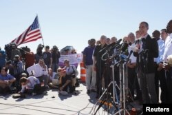 Los Angeles Mayor Eric Garcetti speaks with a group of mayors from across the U.S. outside the children's tent encampment built to deal with the Trump administration's "zero tolerance" immigration policy in Tornillo, Texas, June 21, 2018.