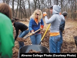 Alverno College students do some outdoor cleanup.