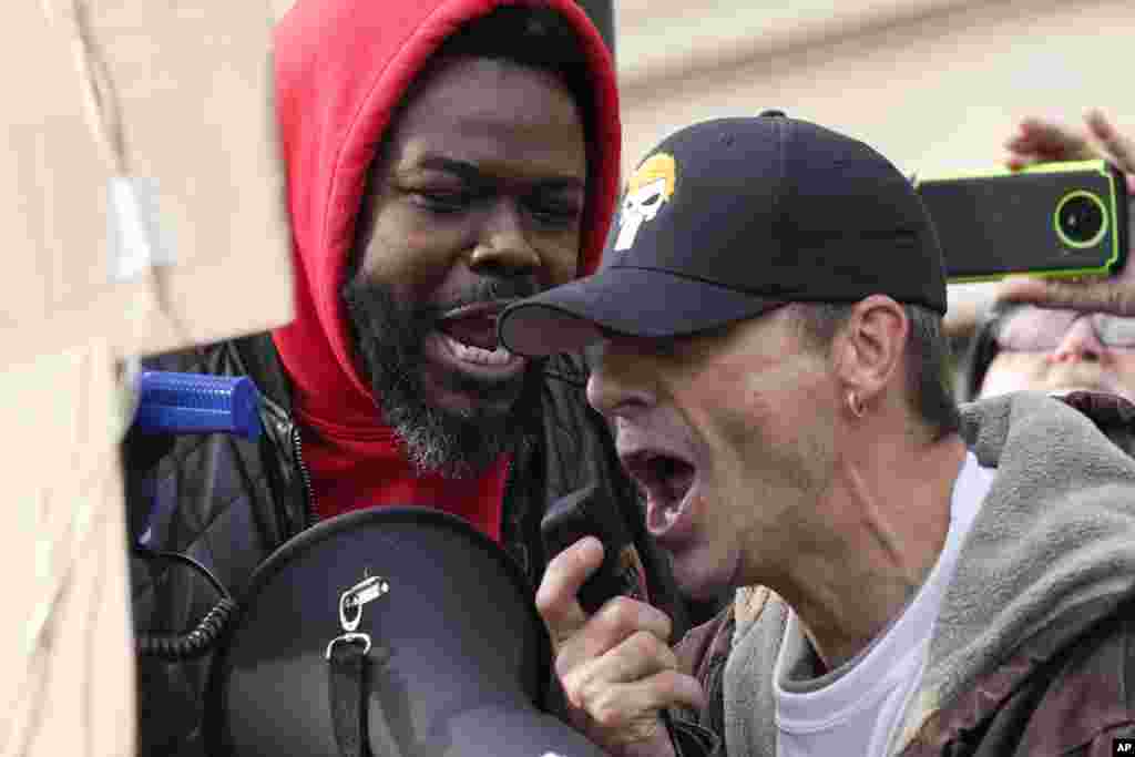 Protesters confront each other outside the Kenosha County Courthouse, Nov. 16, 2021, in Kenosha, Wisconsin, during the Kyle Rittenhouse murder trial.