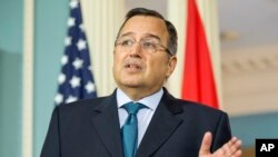 Egyptian Foreign Minister Nabil Fahmy speaks to members of the media during his meeting with Secretary of State John Kerry, Tuesday, April 29, 2014, at the State Department in Washington. 