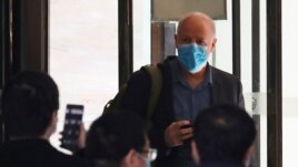 Peter Daszak, a member of the World Health Organisation (WHO) team tasked with investigating the origins of the coronavirus disease (COVID-19), leaves his quarantine hotel in Wuhan, Hubei province, China January 28, 2021. REUTERS/Thomas Peter