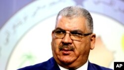 ທ່ານ Khaled al-Obeidi ສະມາຊິກສະພາ ເຜົ່າຊຸນີ ກ່າວຕໍ່ ສື່ມວນຊົນໃນລະຫວ່າງກອງປະຊຸມຕໍ່ນັກຂ່າວ ທີ່ແບກແດດ, ວັນທີ 18 ກັນຍາ 2014. 