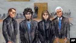FILE - In this courtroom sketch, from left, defense attorney William Fick, Dzhokhar Tsarnaev and defense attorneys Judy Clarke and David Bruck stand as the jury presents its verdict in his federal death penalty trial in Boston, April 8, 2015.
