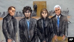 In this courtroom sketch, Dzhokhar Tsarnaev (2nd from Left) is depicted standing with his defense attorneys William Fick (L) Judy Clarke (2nd from R), and David Bruck (R) as the jury presents its verdict in his federal death penalty trial, April 8, 2015, 