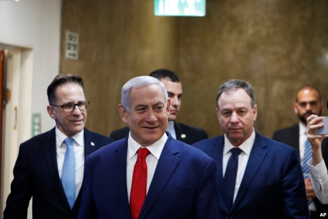 FILE - Israeli Prime Minister Benjamin Netanyahu arrives for his cabinet's weekly meeting, in Jerusalem, April 14, 2019.
