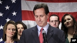 Surrounded by members of his family Republican presidential candidate, former Pennsylvania Sen. Rick Santorum announces he is suspending his candidacy effective today in Gettysburg, Pennsylvania, April 10, 2012.