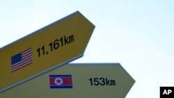 Destination signs to North Korea's capital, Pyongyang, and the United States are seen at the Imjingak Pavilion in Paju, near the border with North Korea, South Korea, Jan. 14, 2022.