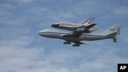 Space shuttle Discovery flown over the Washington area, April 17, 2012