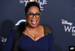 FILE - Oprah Winfrey arrives at the world premiere of "A Wrinkle in Time" at the El Capitan Theatre in Los Angeles, Feb. 26, 2018.