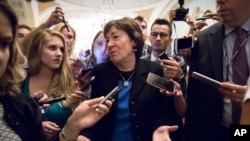 Sen. Susan Collins, R-Maine, is surrounded by reporters on Capitol Hill in Washington, July 13, 2017, after a revised version of the Republican health care bill was announced by Senate Majority Leader Mitch McConnell of Kentucky.