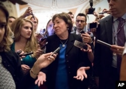 Sen. Susan Collins, R-Maine, is surrounded by reporters on Capitol Hill in Washington, July 13, 2017, after a revised version of the Republican health care bill was announced by Senate Majority Leader Mitch McConnell of Kentucky.