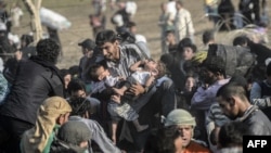 TOPSHOTSSyrians fleeing the war rush through broken down border fences to enter Turkish territory illegally, near the Turkish border crossing at Akcakale in Sanliurfa province on June 14, 2015. Turkey said it was taking measures to limit the flow of Syria