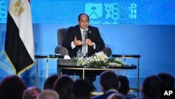 In this photo provided by Egypt's state news agency MENA, Egyptian President Abdel-Fattah el-Sissi, speaks during a youth conference in Sharm El Sheikh, Egypt, Nov. 5, 2018. 