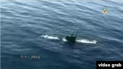 Iranian submarine prepares to fire a Valfajr torpedo as part of a large-scale navy drill. Iranian state media say the test happened Feb. 28, 2017. (Screen grab from Iranian military video)