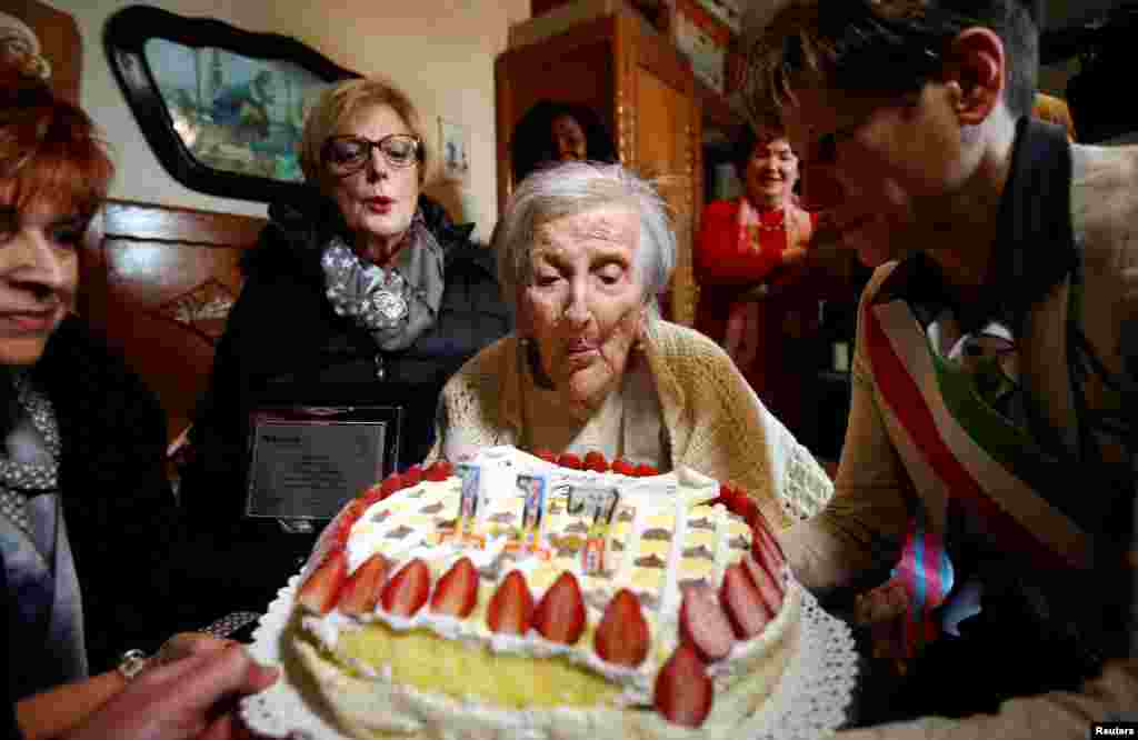 Emma Morano, thought to be the world&#39;s oldest person and the last to be born in the 1800s, blows candles during her 117th birthday in Verbania, northern Italy.