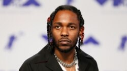 FILE - Musician Kendrick Lamar arrives at the 2017 MTV Video Music Awards in Inglewood, California, Aug. 27, 2017.