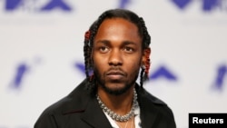 FILE - Musician Kendrick Lamar arrives at the 2017 MTV Video Music Awards in Inglewood, California, Aug. 27, 2017.
