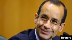 FILE - Marcelo Odebrecht, then the head of Latin America's largest engineering and construction company Odebrecht SA, smiles as he gives his testimony in a session of the Parliamentary Committee of Inquiry in Curitiba, Brazil, September 1, 2015.