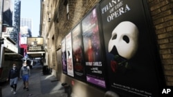 FILE - Broadway posters outside the Richard Rodgers Theatre in New York on May 13, 2020. (Photo by Evan Agostini/Invision/AP, File)