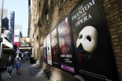 FILE - Broadway posters outside the Richard Rodgers Theatre in New York on May 13, 2020. (Photo by Evan Agostini/Invision/AP, File)