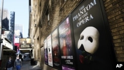 FILE - Broadway posters outside the Richard Rodgers Theatre in New York on May 13, 2020. (Photo by Evan Agostini/Invision/AP, File)