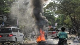 A fire burns on the street during a protest against the military coup, in Mandalay, Myanmar April 1, 2021. REUTERS/Stringer