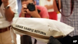 The Apollo 11 Contingency Lunar Sample Return Bag used by astronaut Neil Armstrong, to be offered at auction, is displayed at Sotheby's in New York, July 13, 2017. 