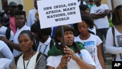 FILE - African students participate in a protest against the alleged assault of Tanzanian woman in Bangalore, India on Feb. 6, 2016. 