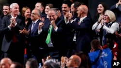 Delegates of Canada, Mexico and the United States celebrate after winning a joint bid to host the 2026 World Cup at the FIFA congress in Moscow, Russia, June 13, 2018. 
