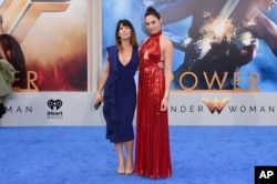 FILE - In this May 25, 2017 file photo, director Patty Jenkins, left, and actress Gal Gadot arrive at the world premiere of "Wonder Woman" at the Pantages Theatre in Los Angeles.