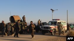 Afghan security force arrive near the site after a suicide bomber blew himself up inside a packed mosque on an Afghan army base in Khost province, Nov. 23, 2018.